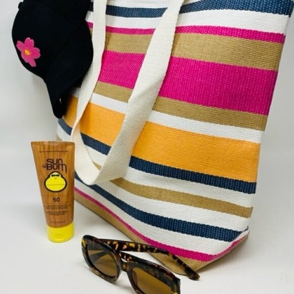 Sunbum SPF 50 Sunscreen, Beach Tote, flowered baseball cap, tortoise sunglasses - Picture 2 of 3